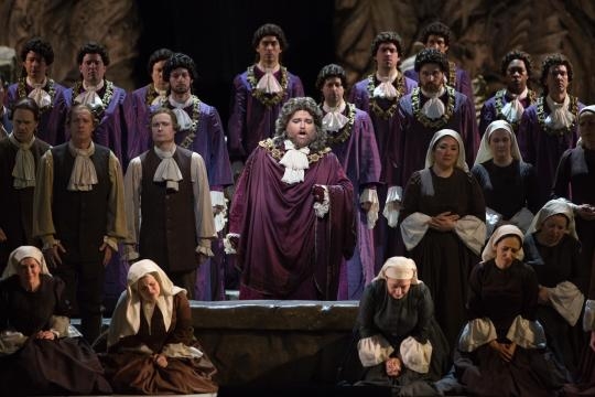 Neptune’s high priest (Noah Baetje) and the magnificent Metropolitan Opera Chorus. Photo: Marty Sohl/Metropolitan Opera, used with permission.