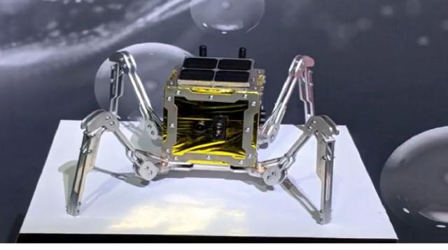 UK unveils tiny walking rover that will explore the moon. [Image source/Daily News Today YouTube video]