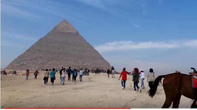 Tourists visit in Great Pyramid of Giza, in Egypt. [Charles Huang/YouTube/Screencap]